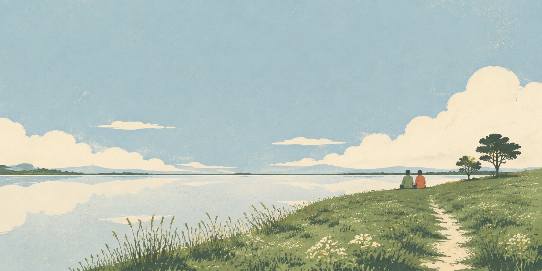 Two people sitting quietly beside a wide, still lake